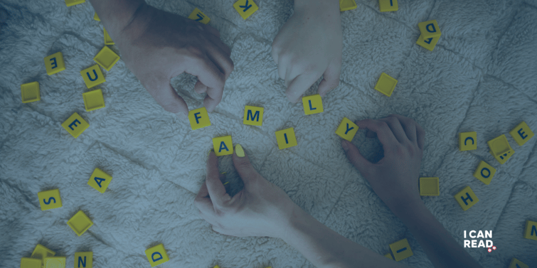 A game of scramble is at play with the word 'family' being spelt out with the letter tiles.