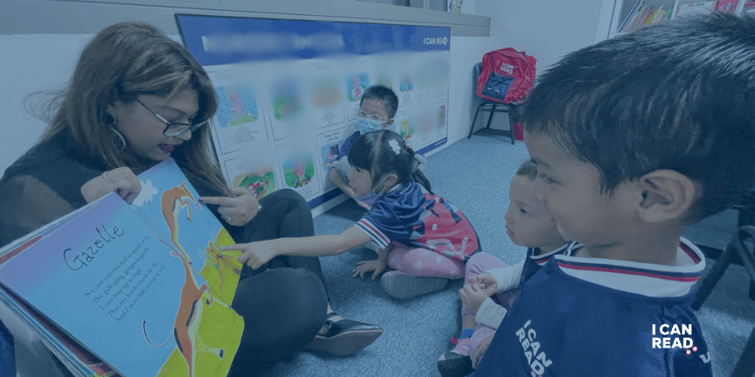 Teacher reading a book with the students in a I Can Read class.