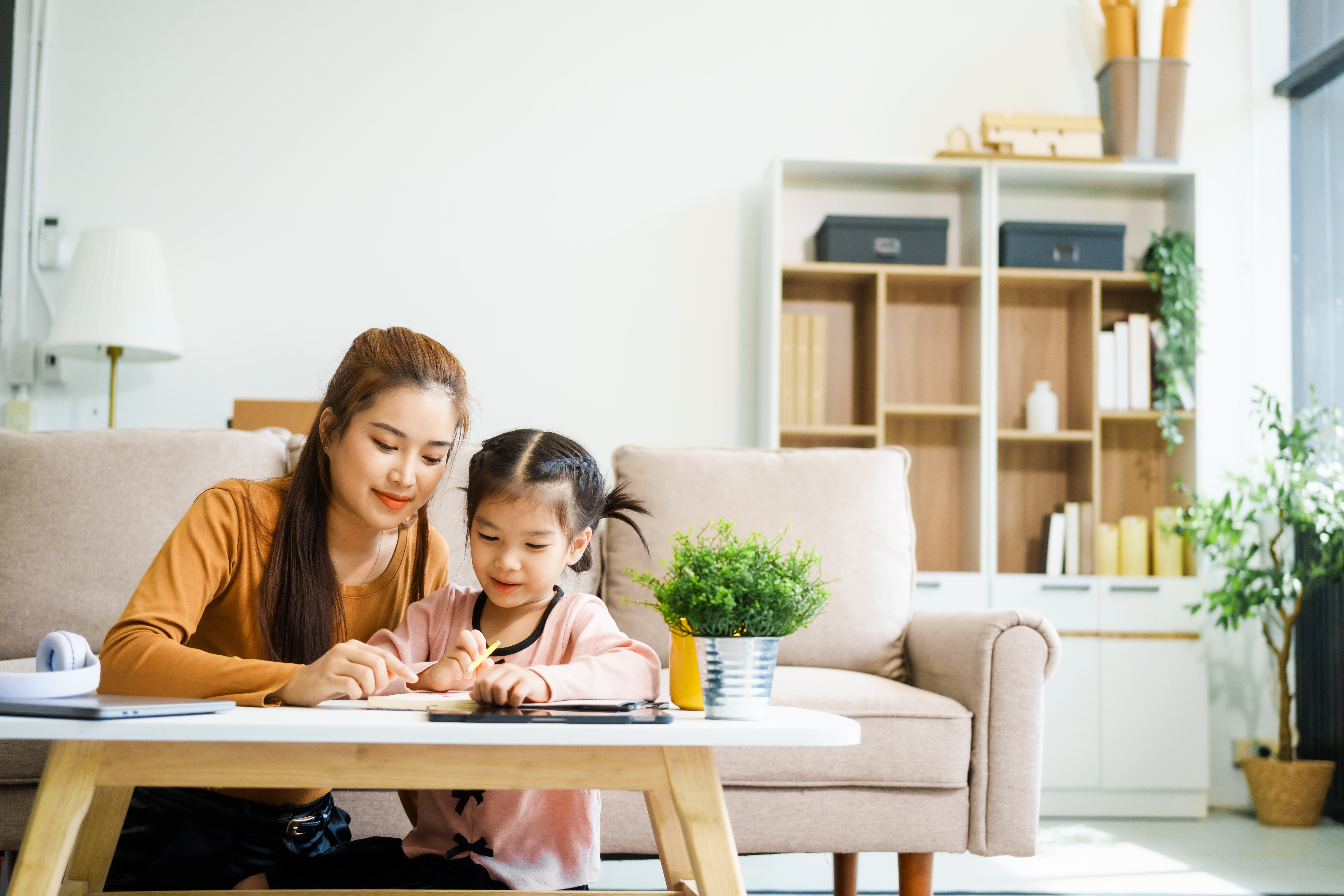 an-asian-mother-and-her-adorable-daughter-sit-on-t-2025-02-15-19-54-24-utc